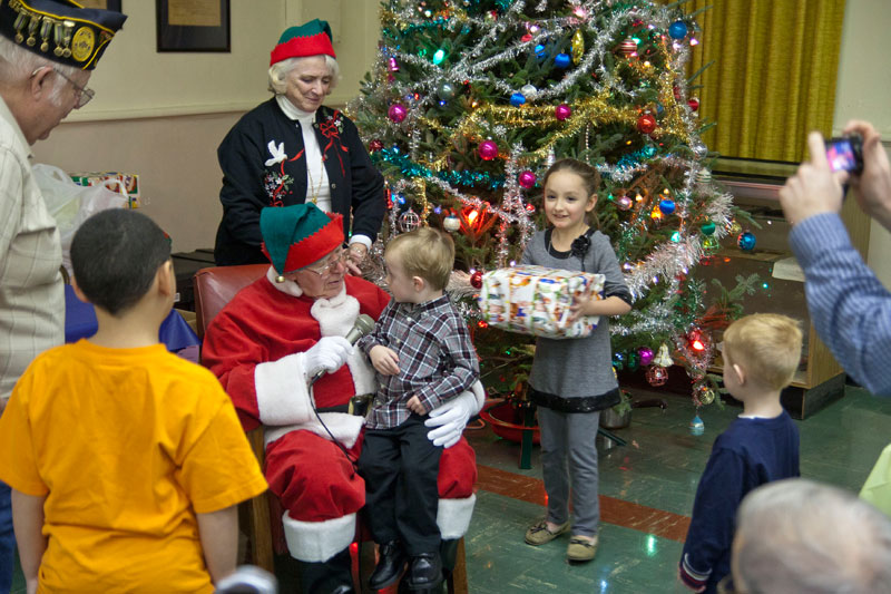Santa's helpers listened to each child's wishes and handed out gifts.