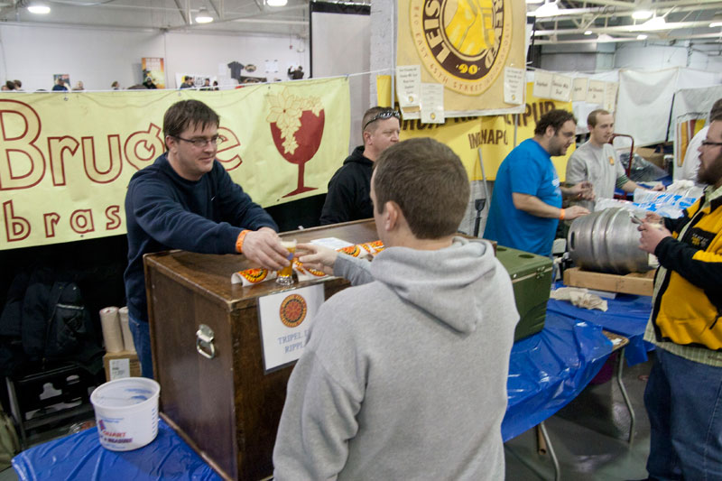 Ted Miller pouring his Belgian beer from Brugge Brasserie.