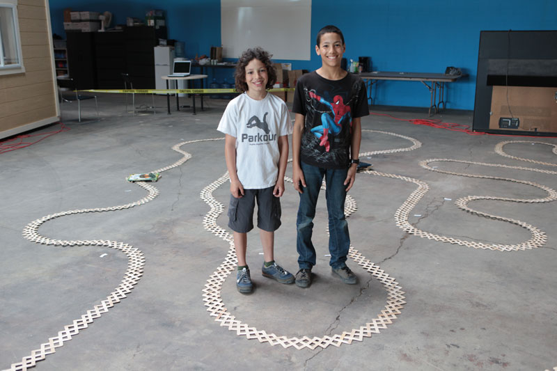Andre Jefferson and Miles Parnell standing in the 11,000 stick run at DeveloperTown.