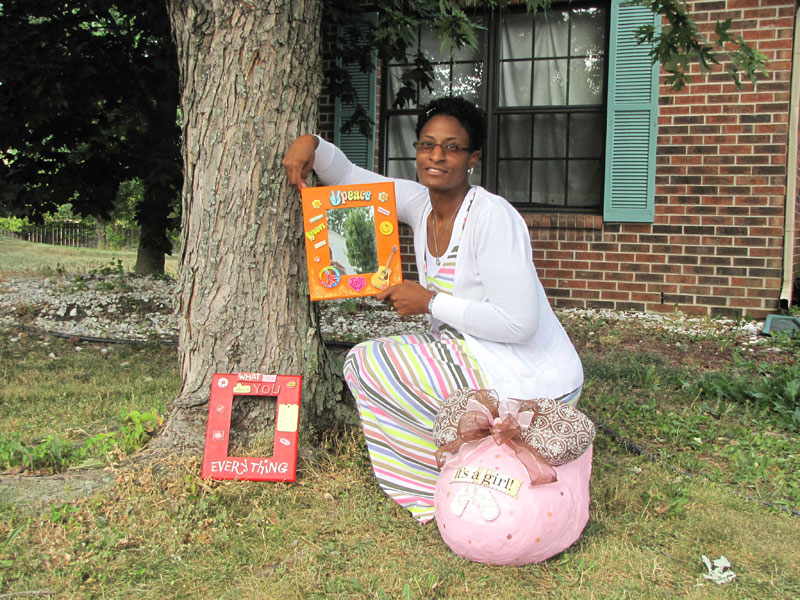 Azsure Bailey displays some of her artwork.