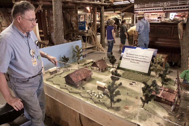 Robert Hessong, relative of Oliver Johnson, in the Pioneer Barn to discuss the model of the Johnson Family farm. The farm was where the State Fairgrounds are today. Robert is also the co-author of Ollie's Cabin in the Woods available on Amazon.com