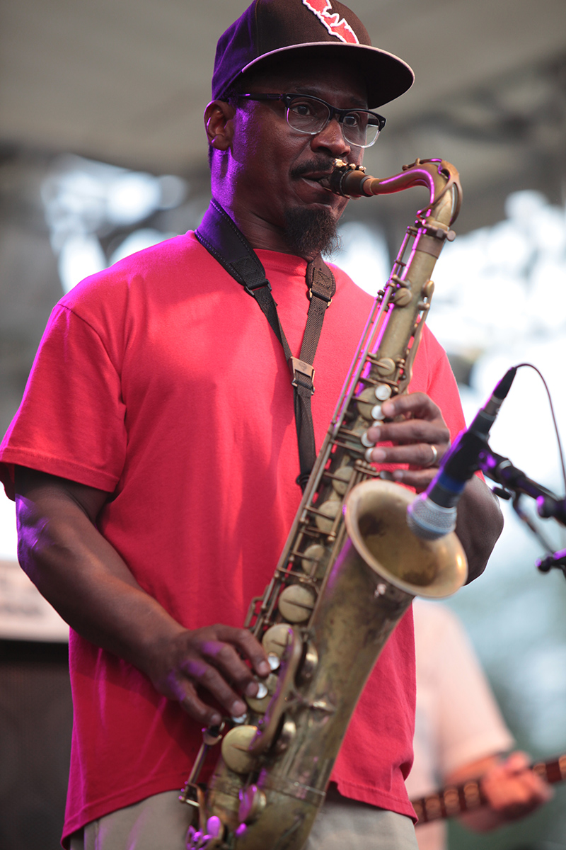Karl Denson performed on saxophone, flute, vocals, and a variety of instruments, leading Karl Denson's Tiny Universe in a rousing performance.