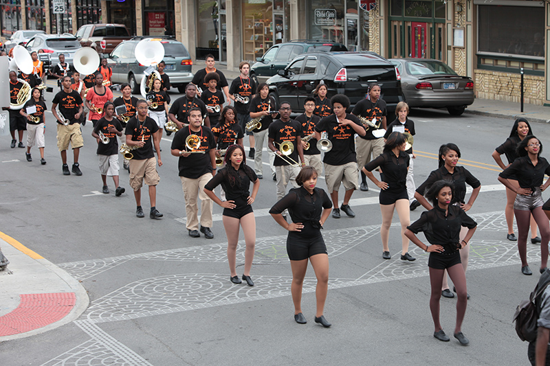 The Fire + Fitness Dance Team and the Marching Band coming down Broad Ripple Avenue.