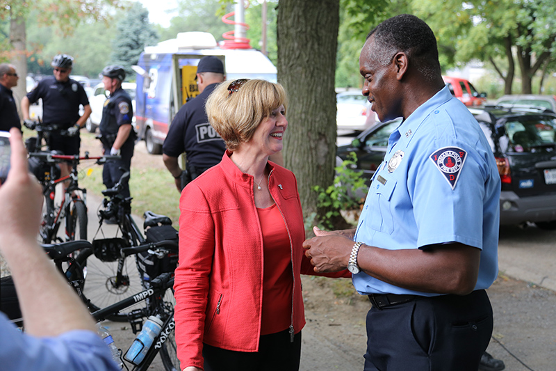 Susan Brooks, United States Representative for Indiana's 5th congressional district back in Indy from Washington, DC, here seen at The Bike Line talking to Indianapolis Fire Department Captain Gregg Harris from Broad Ripple station 32.