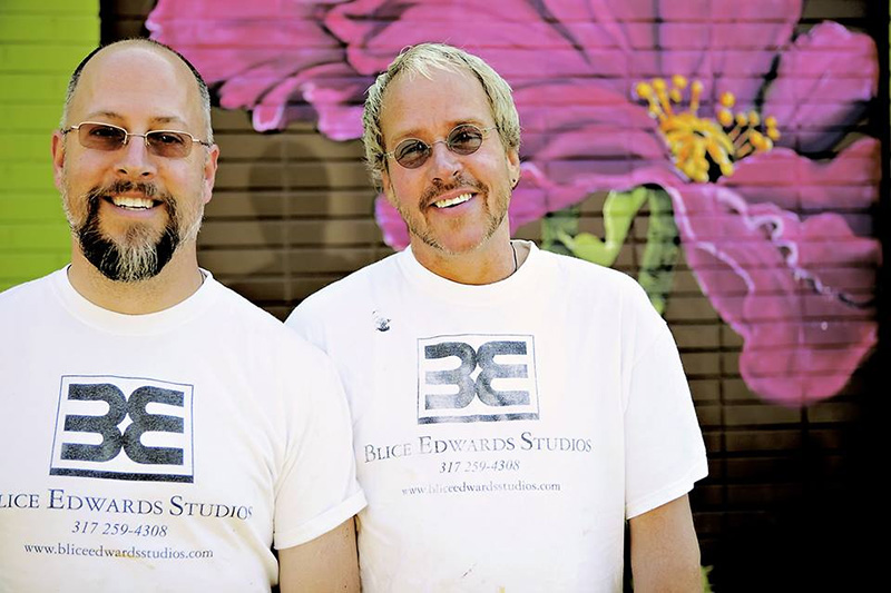 Jon Edwards and Chris Blice with their Posh Petals mural on 54th street.
