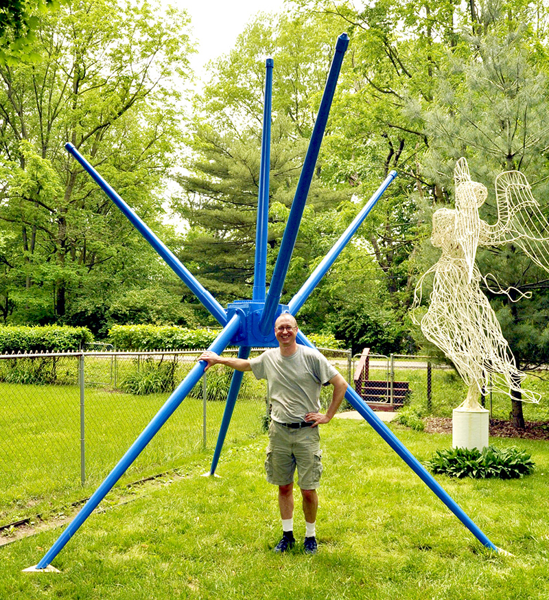 Patrick Mack with his Star Light, Star Bright and Angel of Mercy sculptures along the Monon Trail.