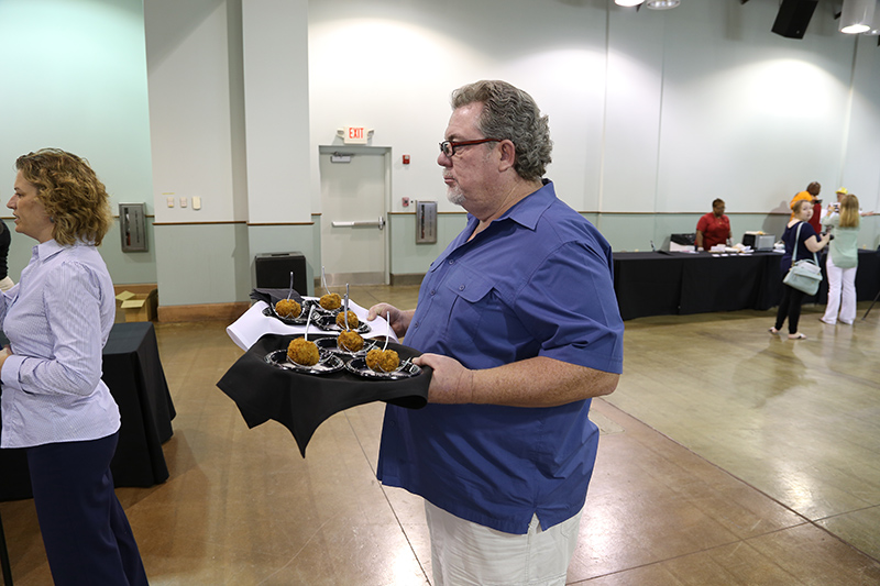John Barto ready to present Barto's Catering Cheeseburger on a Stick to the panel of tasters.