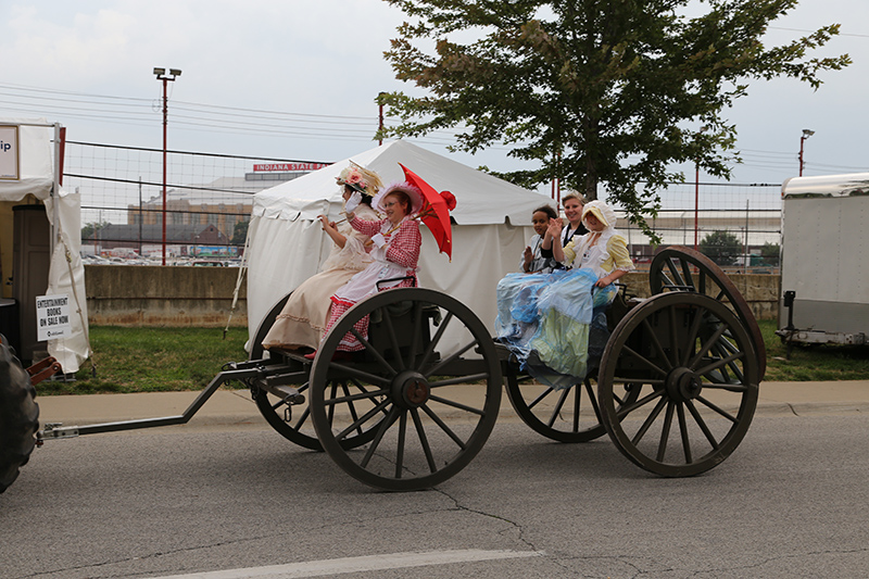 Turn-of-the-century ladies in the daily tractor parade