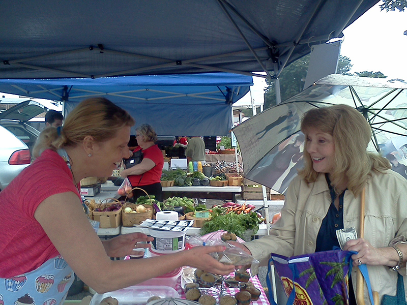 Kathy Lewston buys some goodies from Jenny Cleave of Simple Tastes.