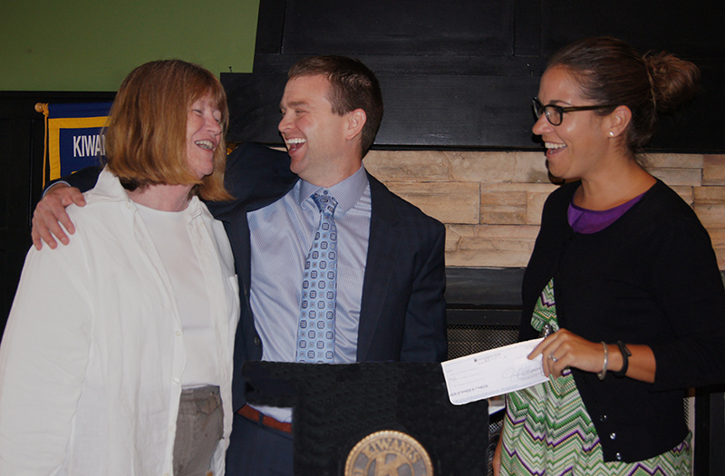 Kyle Sanders, President, and Brenda Rising-Moore. President-Elect, happily presenting to Jennifer Bartenbach.
