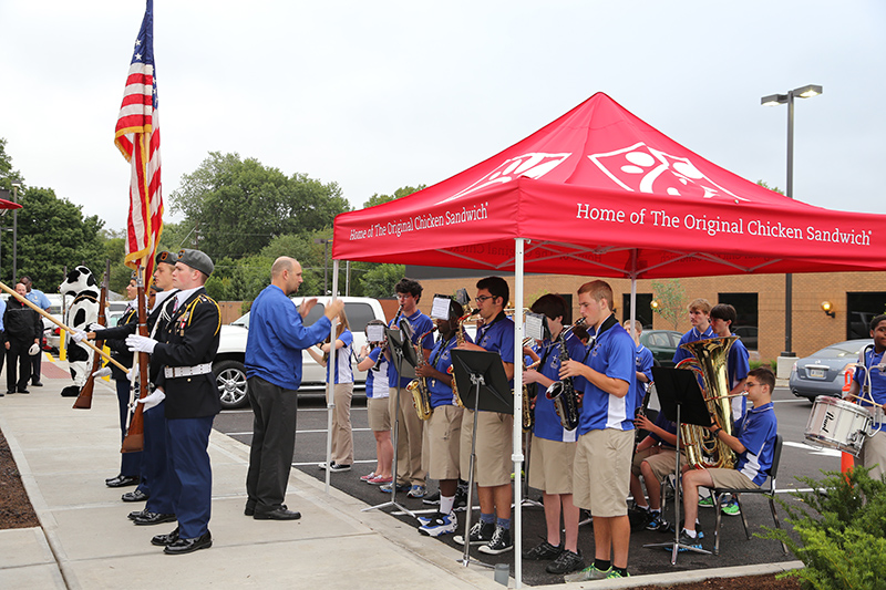 The North Central Color Guard and the Bishop Chatard band at the opening day ceremony.