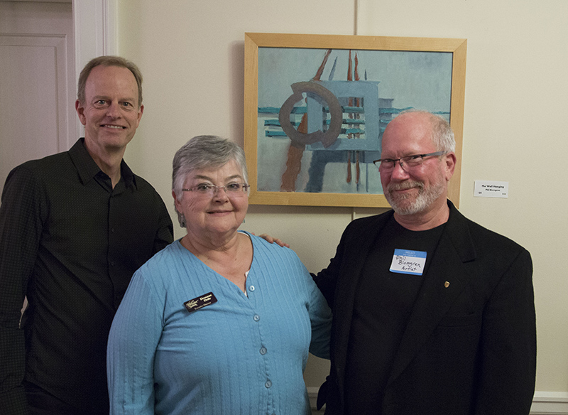 Bruce Buchanan, Donnae Dole, and artist Phil Blomgren in front of Phil's The Wall Hanging at Flanner & Buchanan, 1305 Broad Ripple Avenue.