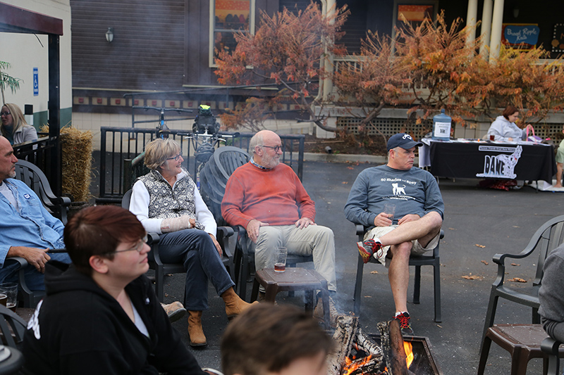 Nancy and John Hill enjoying the fire and the dogs