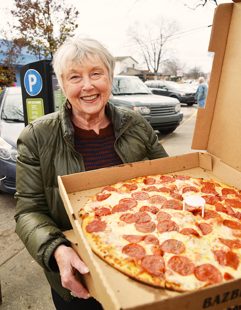 Bungalow owner Diane Seybert with a Bazbeaux pizza