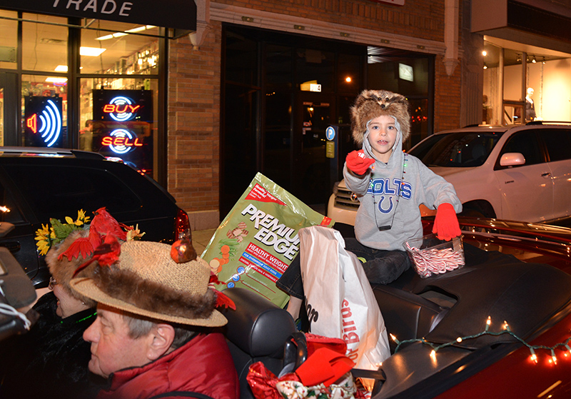 Brandt Carter and Steve Pearson drive the Backyard Birds car in the parade
