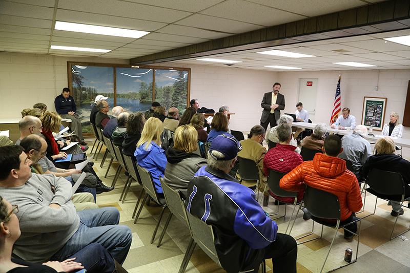 Mike Massonne addressing a full house of Rocky Ripple residents.