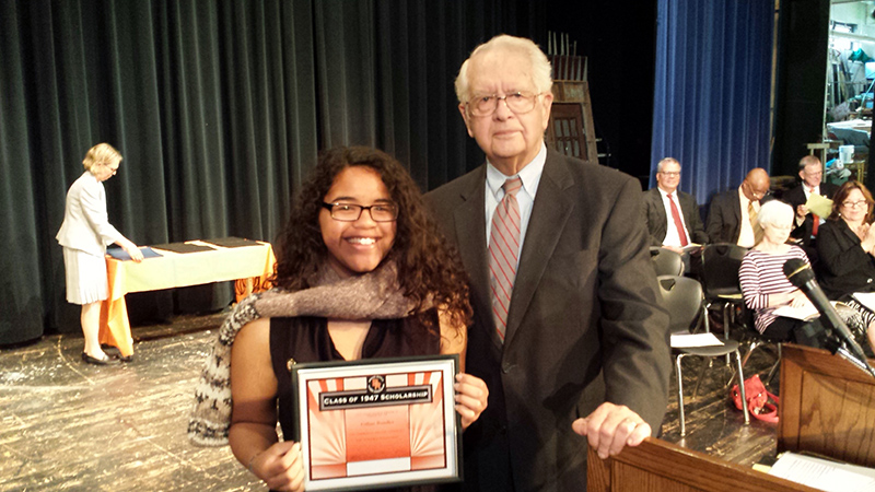 Class Valedictorian Gillian Bundles with Class of 1947 $1000 Merit Scholarship presented by BRHSAA Director John D. Hague.