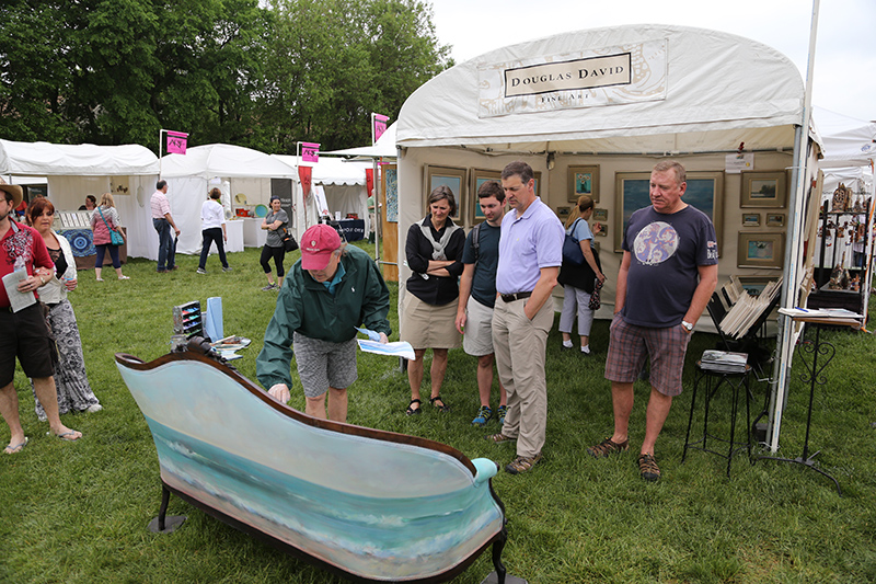 Douglas David painted a vintage sofa at the fair.