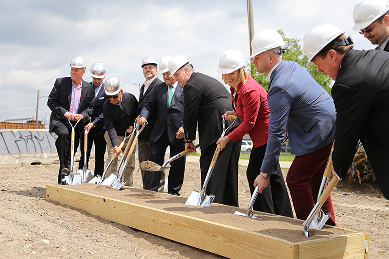 Mayor Ballard with the first scoop of dirt. To his right, Michael Browning. To his left, Elizabeth Marshall and Chris Sherrell.