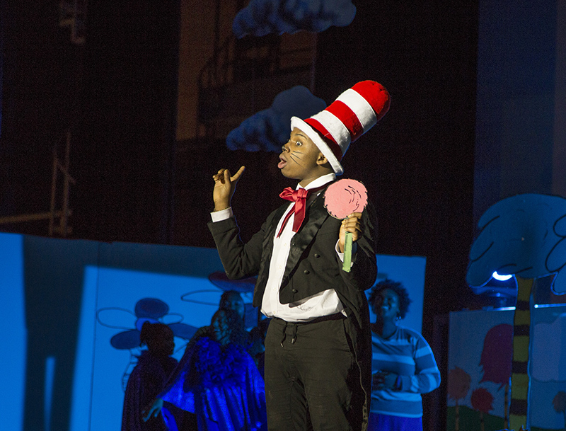 The Cat in the Hat (Leondre Burgess) holds the Whos.
