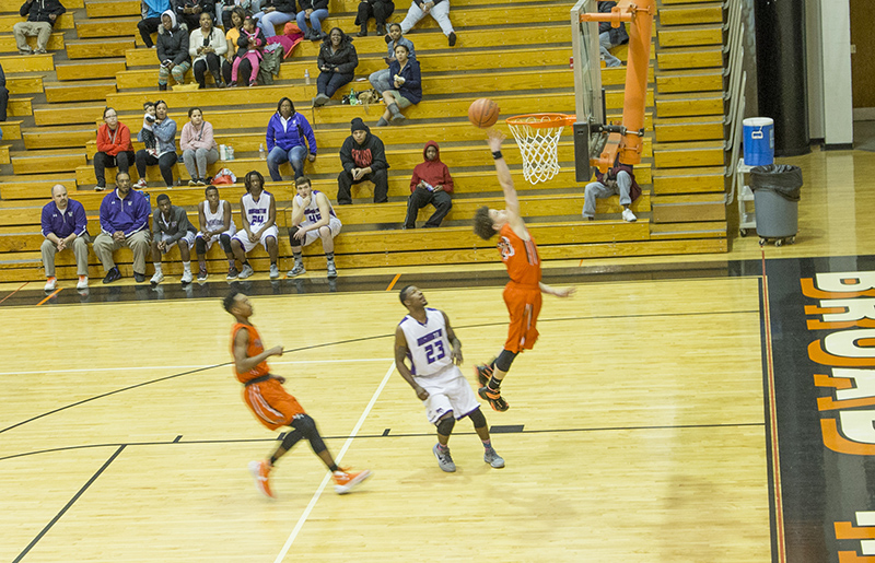 The crowd sat with mouths open as Sam Colbert went for the goal. The Rockets beat Washington 105-34.