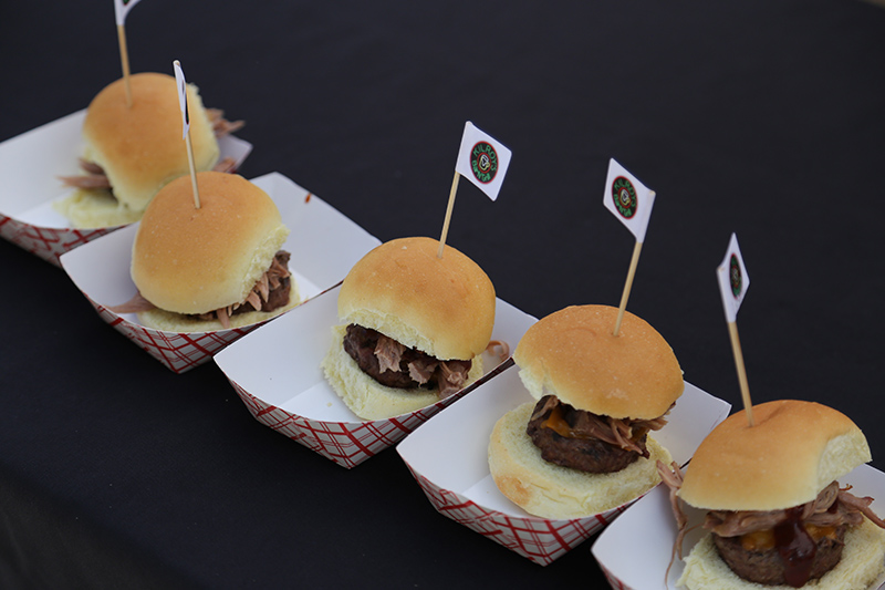 Kilroy's Big Texan Slider - Burger topped with slow smoked pulled pork, melted cheddar cheese, sweet BBQ sauce and a crispy onion petal.