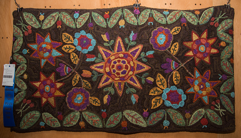 Linda Ohlman received 1st place for her hooked rug.