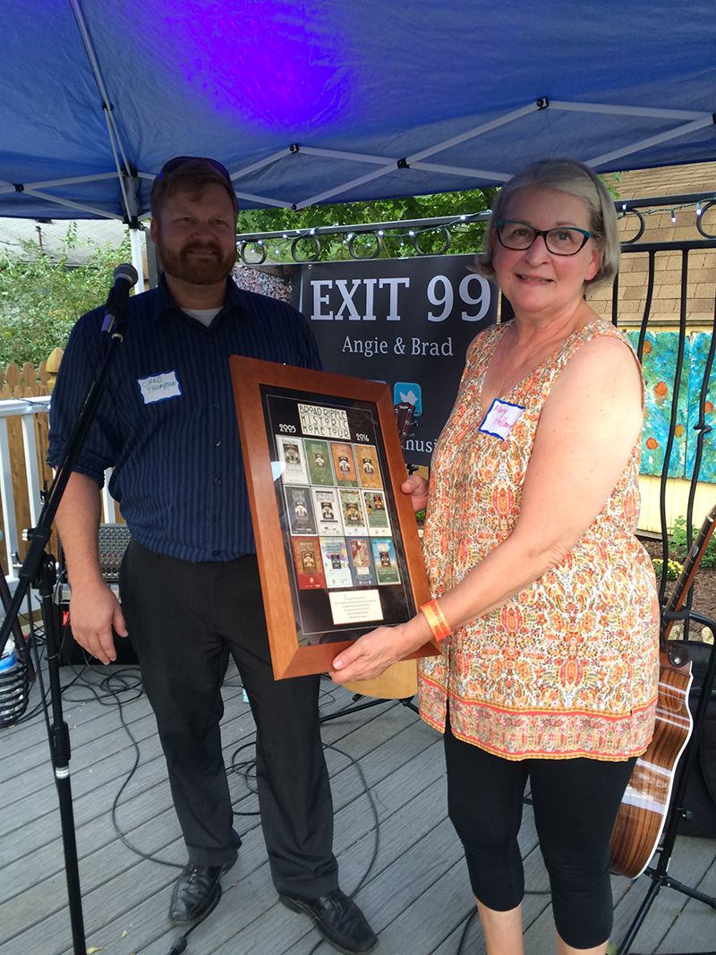 Tour co-chairs Chad Thompson and Mary Holland. Mary received a plaque at the pre-tour party at Joy's House for her 5 years of service to the tour.