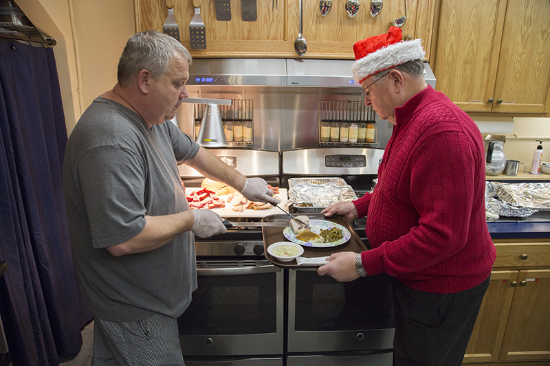 Casey Kehrer serving turkey from the Historic Steer-In