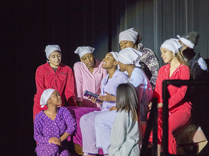 Deloris Van Cartier (N'Deya Fuqua) singing Bless Our Show with the other (