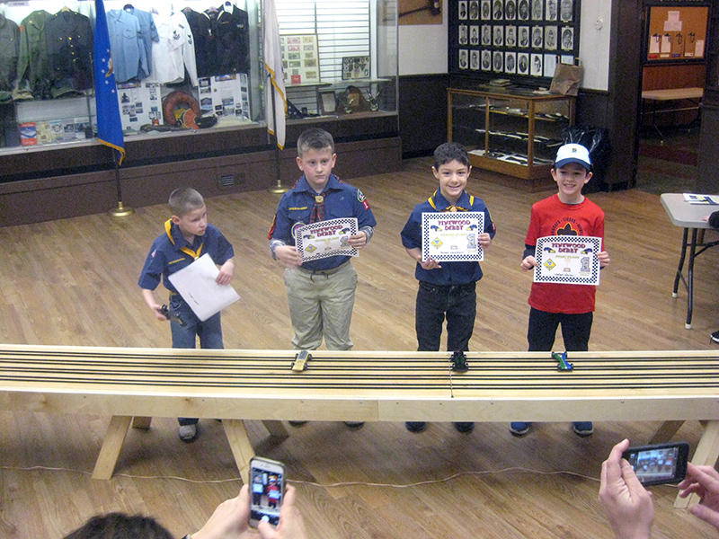 The winners posed for pictures with their cars.