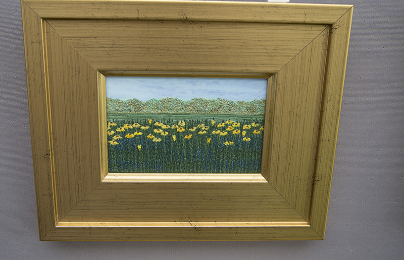 The thread art of Teri Oja. She paints a picture, then stitches over it.