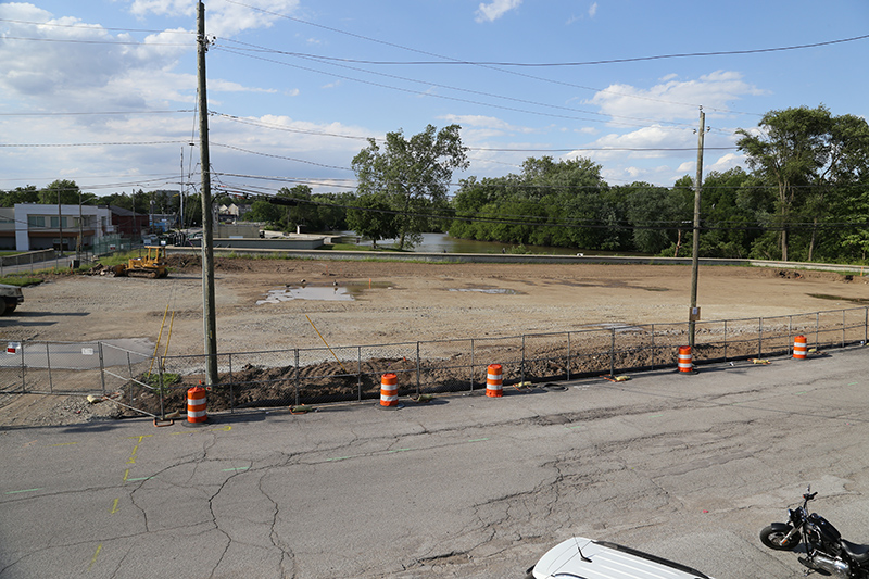 The next apartment building construction will be where the red building is in the middle left of this photo, above the yellow bulldozer (the old Rogers Pool site).