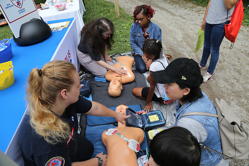 CPR demonstrations at the Indianapolis Emergency Medical Services booth.