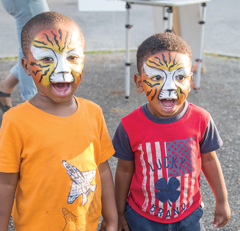 After getting their faces painted at the BR Carnival, brothers Omari and Omir gave us their best growls.