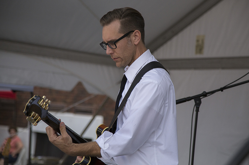 Is that Don Draper on guitar? Maybe not, but it is the Midtown Mad Men on stage at the Market.