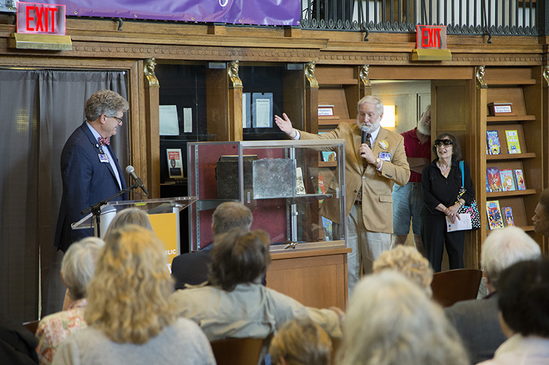 Dr. David Wantz, President Library Board of Trustees and Michael Williams, Manager Central Library, unveiled the time capsule that was placed in the building in 1917.