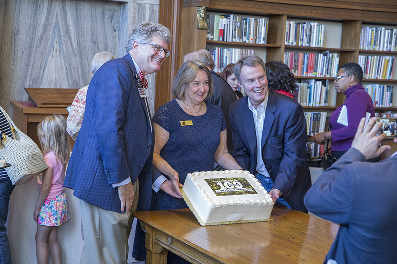 Dr. David Wantz, President Library Board of Trustees, Jackie Nytes, CEO IndyPL, and Mayor Joe Hogsett cut the cake for the anniversary party.