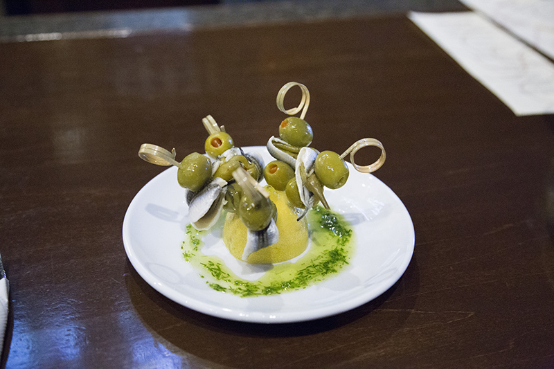 Txuleta's delicious Gilda small plate: olives, piparra peppers, and boqueron (white anchovies)