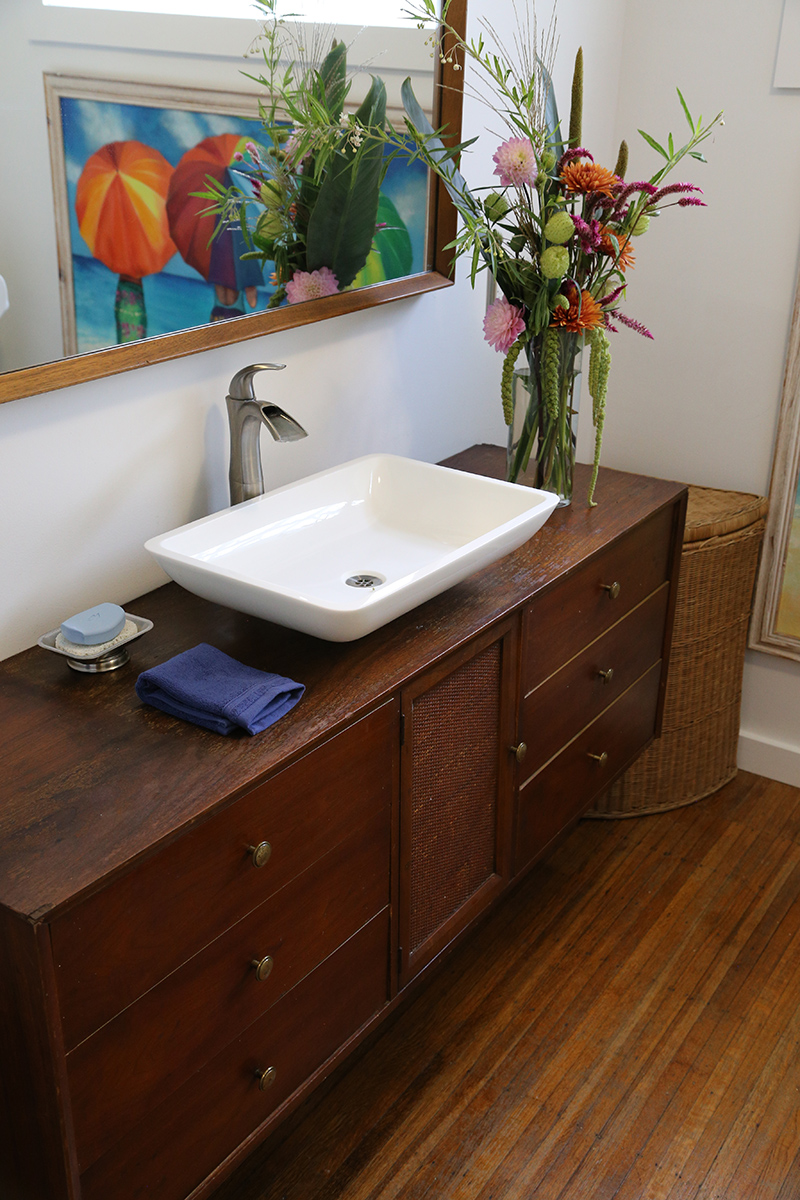 A piece of family furniture hung on the wall and converted to a vanity at 6151 N. College Avenue