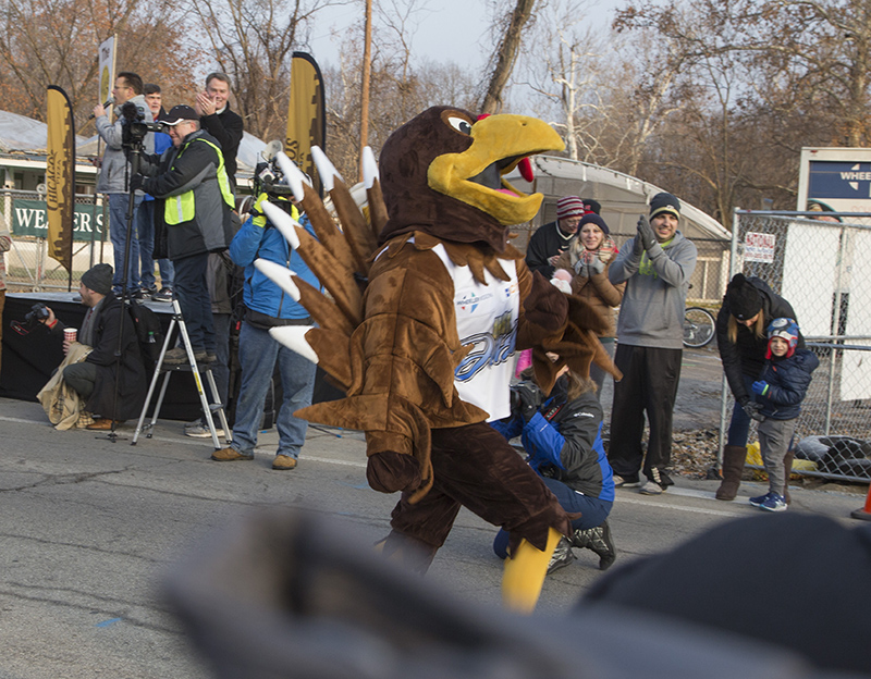 Mayor Hogsett (upper left) watches as the Turkey gets a head start before the runners take off to catch him