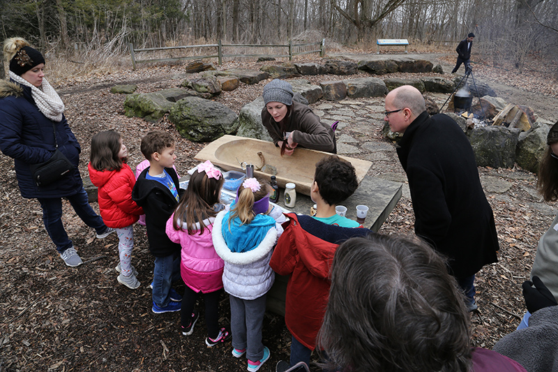 A lesson in extracting maple syrup from sap at the evaporation station.