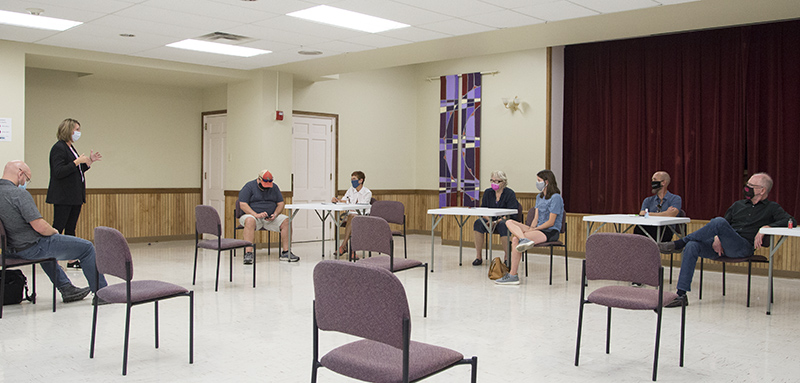 Jennifer explains the proposed charging station to the committee.