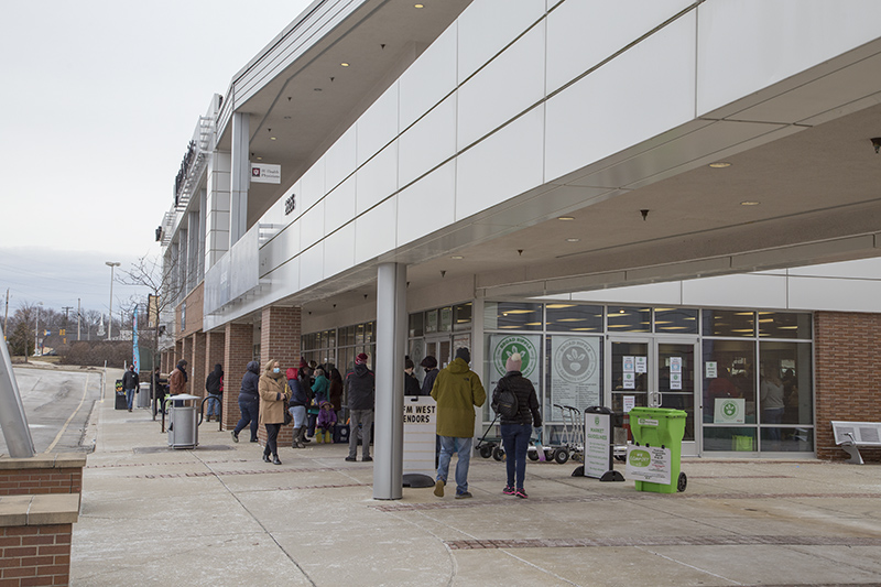 The line for lobsters reaches to the main market entrance to the right