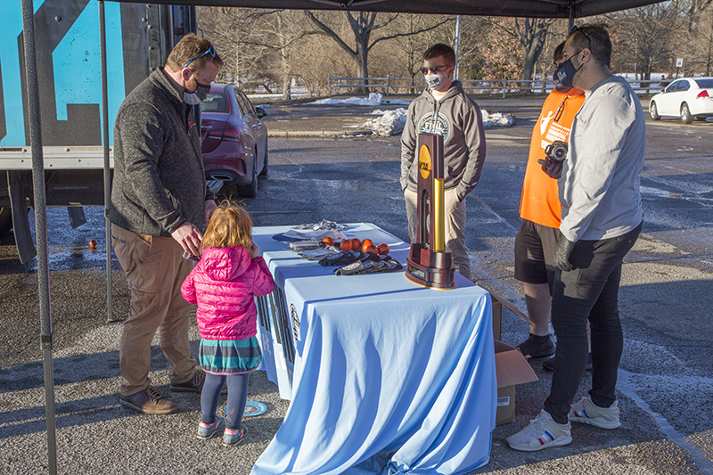 Random Rippling - NCAA swag giveaway at park