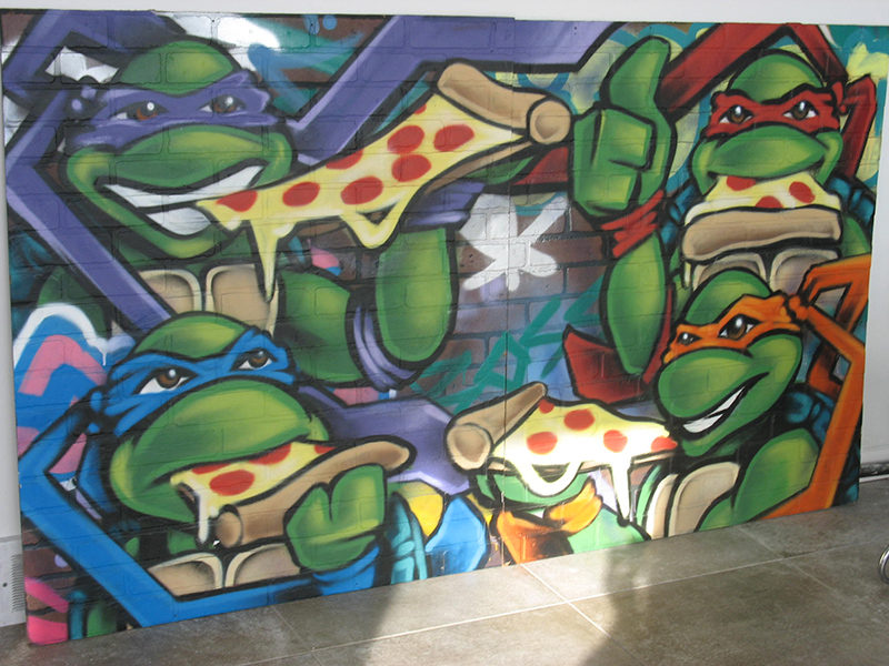 A Teenage Mutant Ninja Turtle mural by Rafael Caro at Chromatic Collective.