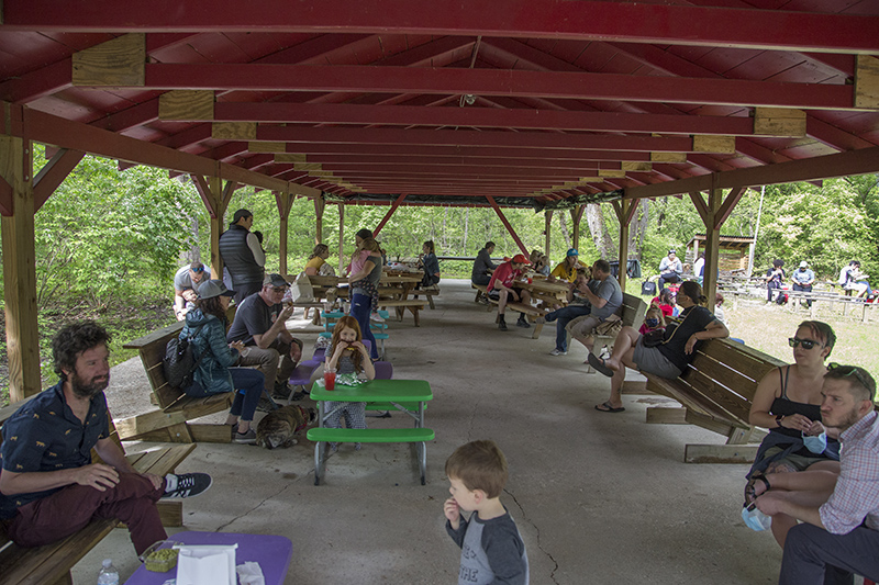 Lots of people in the shelter by the music