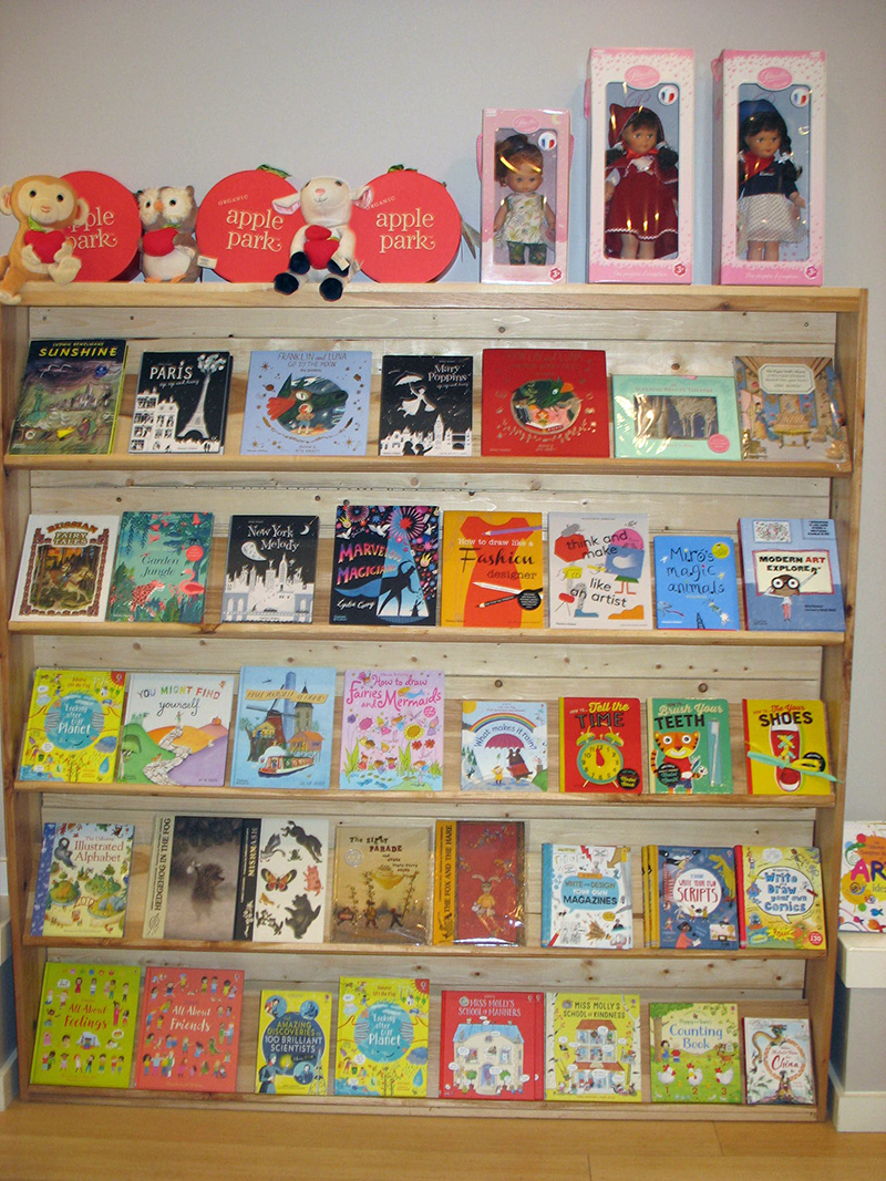 A variety of dolls and books.