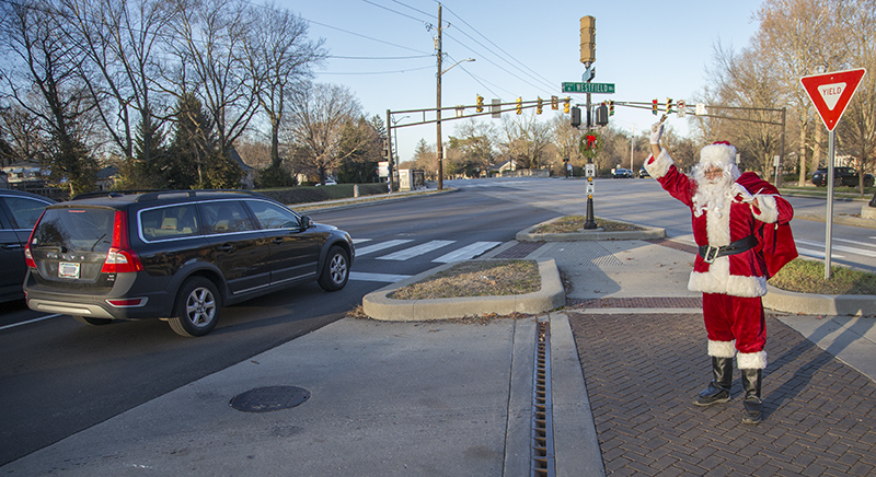 Santa waving to passing cars