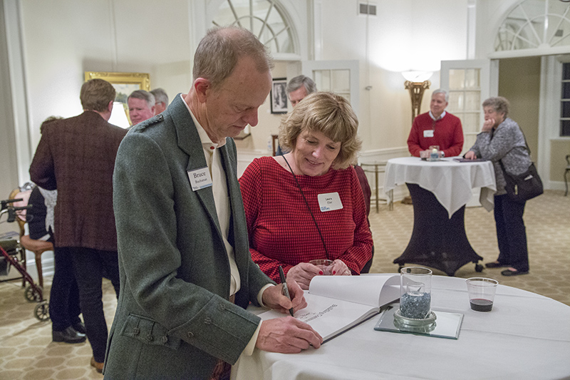 Bruce Buchanan inscribing one of the books